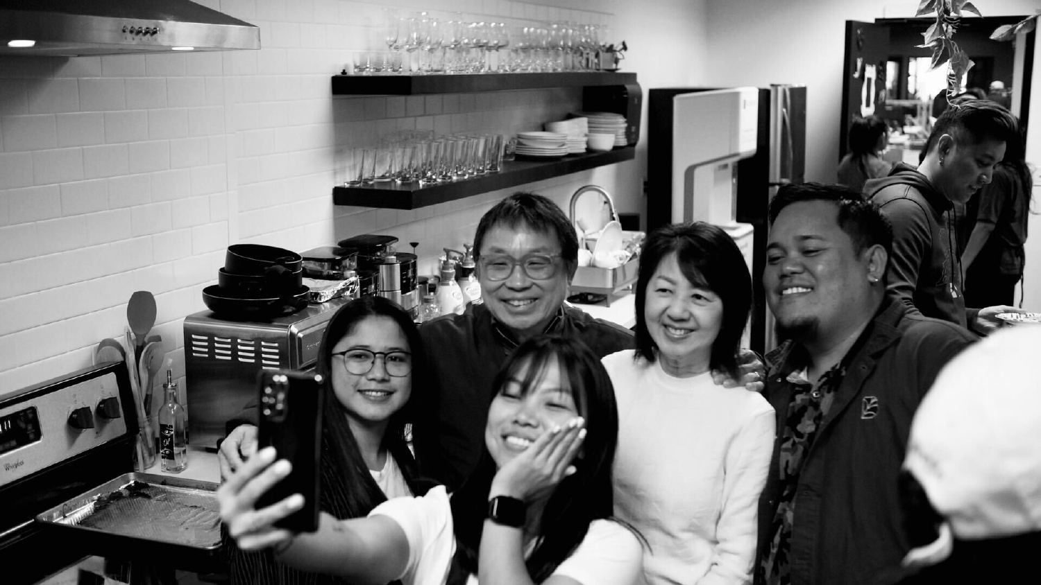 MDB Co. founders Daniel and Marianne Fong, posing for a selfie with office team members.
