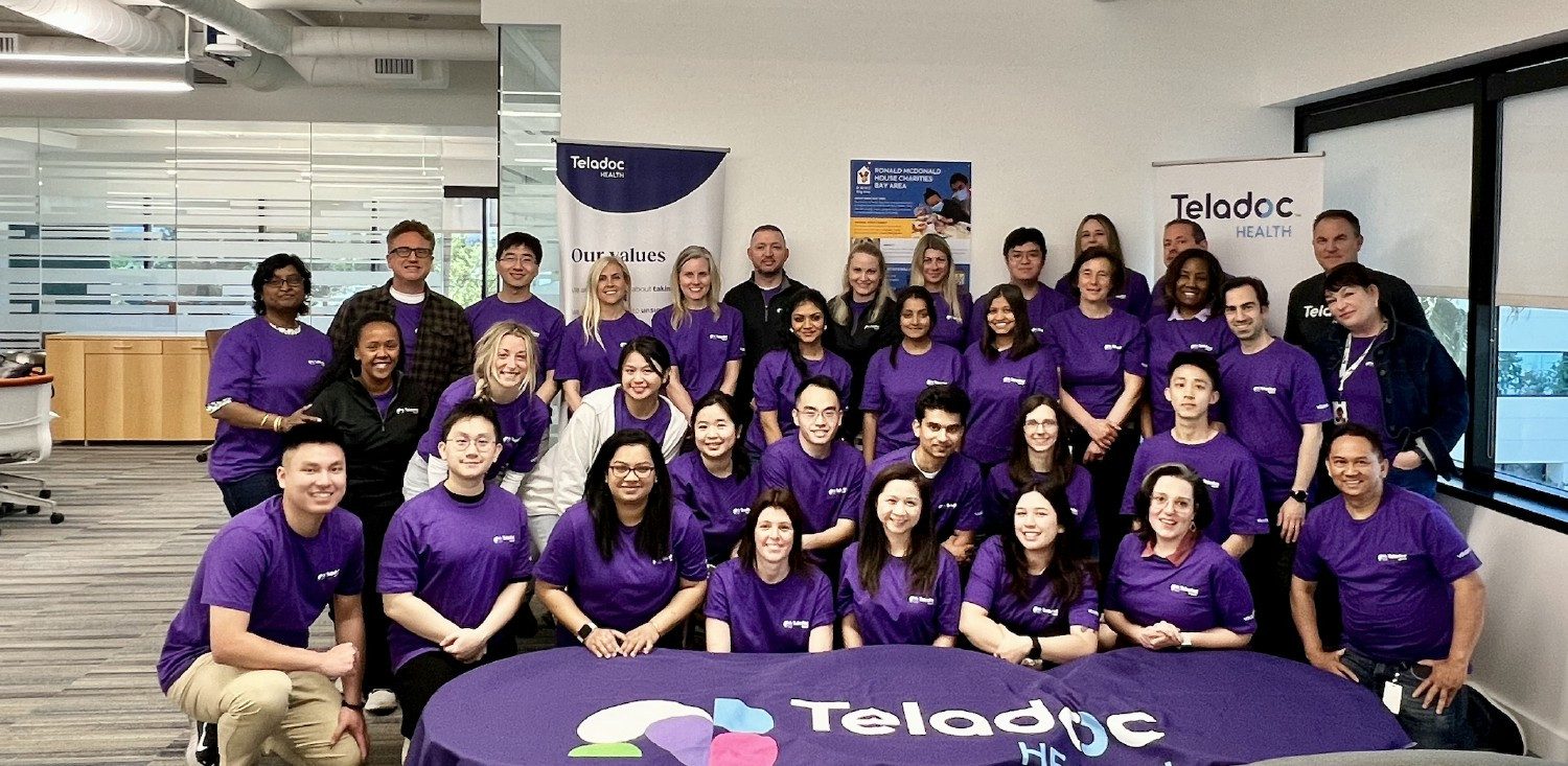 Teladoc Health colleagues participating in a neighborhood event